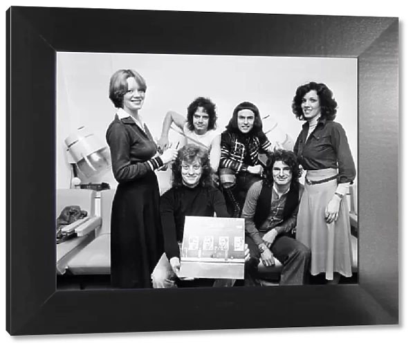 Slade in West Bromwich, with a copy of their new album '