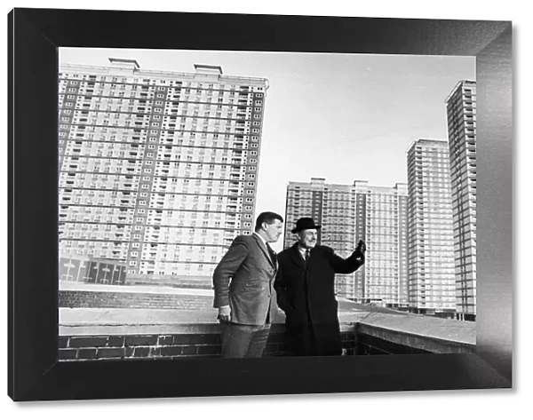 Enoch Powell looks at the Red Road Flats in Glasgow with the prospective candidate for