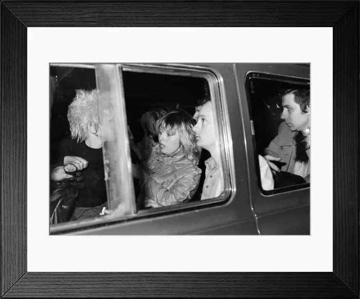 Framed Print : Sex Pistols Jubilee boat party on the Thames. Pictured, guests as they are taken away by Framed Print : Sex Pistols Jubilee boat party on the Thames. Pictured, guests as they are taken away by