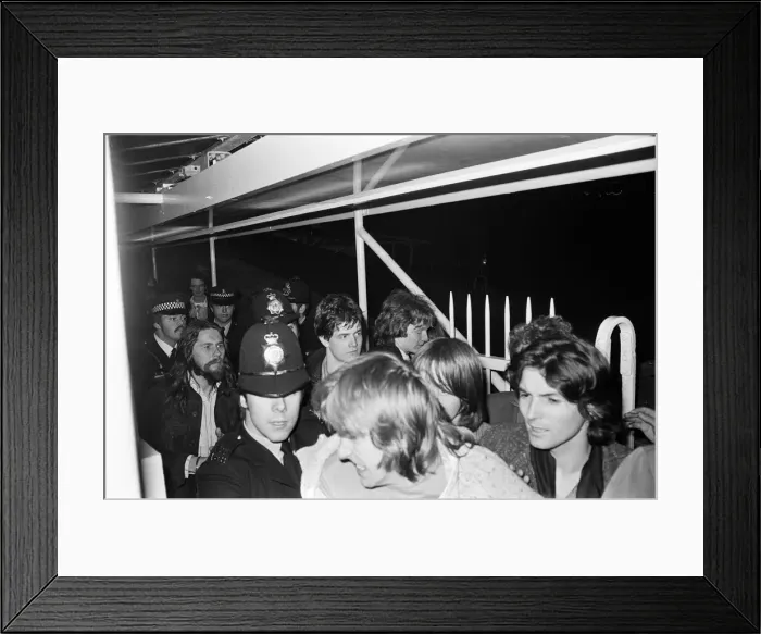 Framed Print : Sex Pistols Jubilee boat party on the Thames. Pictured, guests as they are taken away by Framed Print : Sex Pistols Jubilee boat party on the Thames. Pictured, guests as they are taken away by