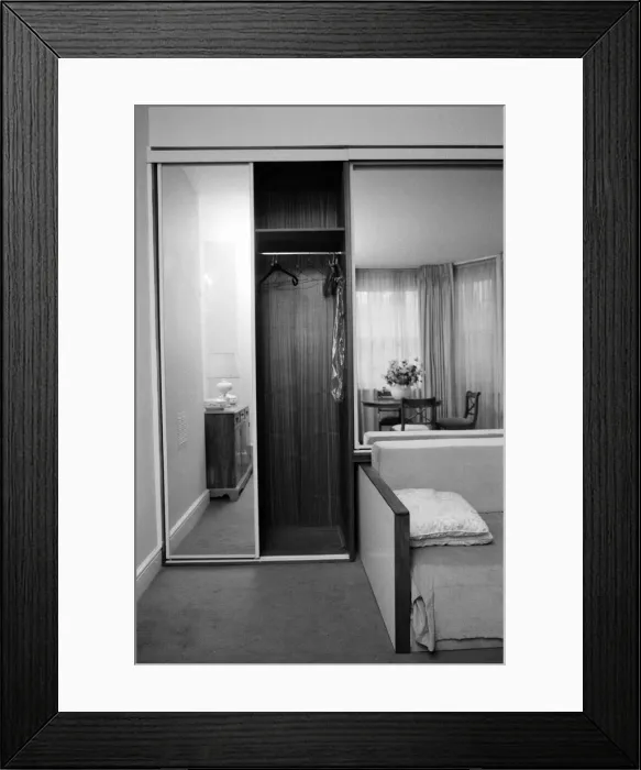 Framed Print : Interior view of a flat, showing the living room area, mirrored wardrobe and sofa bed Framed Print : Interior view of a flat, showing the living room area, mirrored wardrobe and sofa bed