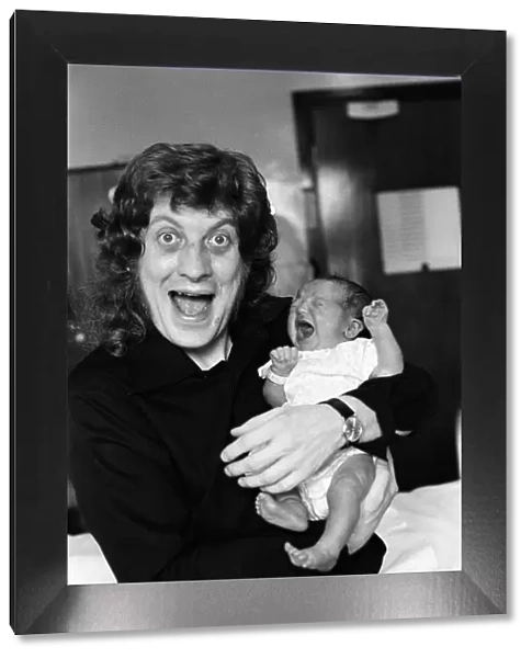 Noddy Holder with his baby daughter Jessica. 8th September 1978