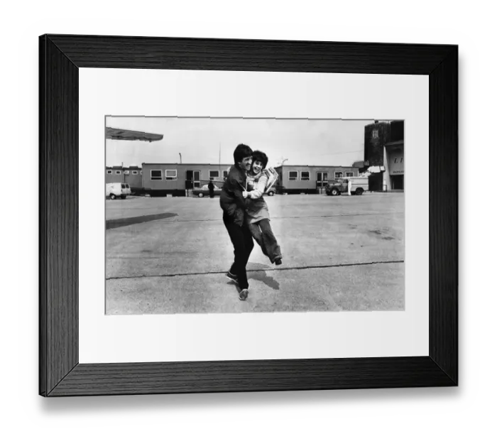 Framed Print : Liverpool footballer David Johnson receives an enthusiastic embrace as the team depart Framed Print : Liverpool footballer David Johnson receives an enthusiastic embrace as the team depart