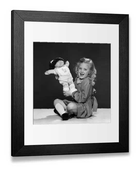 Framed Print : Keri Reynolds, aged 5, with her Cabbage Patch doll. 2nd December 1983 Framed Print : Keri Reynolds, aged 5, with her Cabbage Patch doll. 2nd December 1983