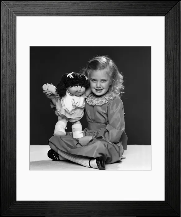 Framed Print : Keri Reynolds, aged 5, with her Cabbage Patch doll. 2nd December 1983