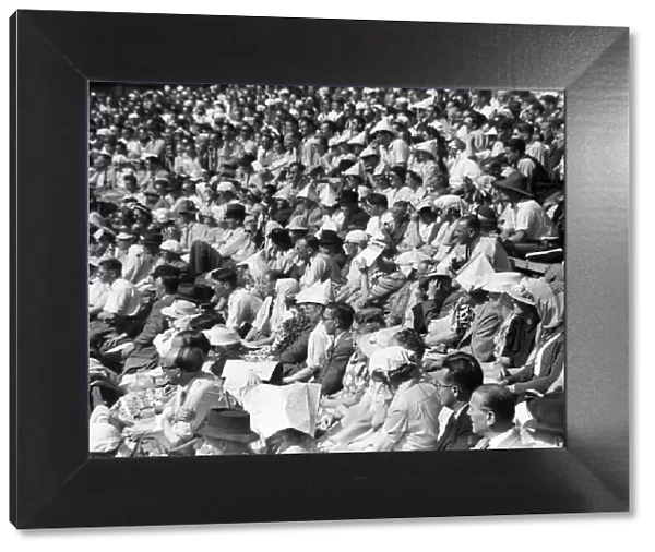 Wimbledon Tennis Championships. The audience watch the game, on this hot day