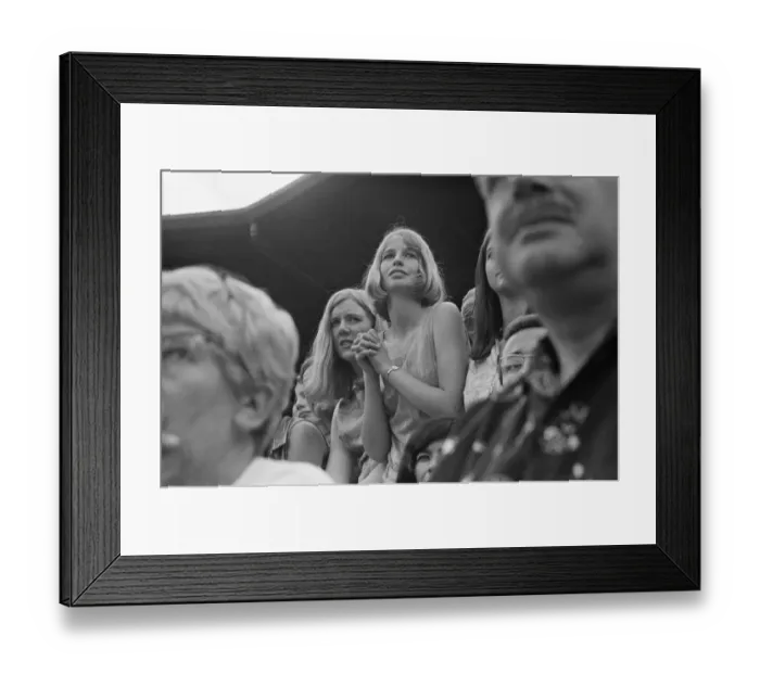 Framed Print : A pretty young Tennis Fan watches the Taylor v Drysdale match at Wimbledon Tennis