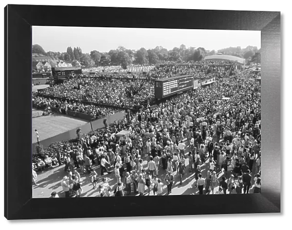 Wimbledon Tennis Championships. The huge crowd mill around the Tennis courts