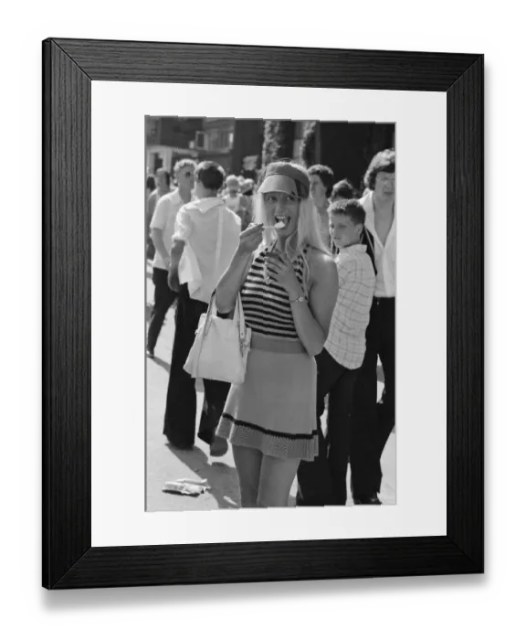 Framed Print : Wimbledon Tennis Championships. A tennis fan enjoys an ice cream at The Wimbledon Framed Print : Wimbledon Tennis Championships. A tennis fan enjoys an ice cream at The Wimbledon