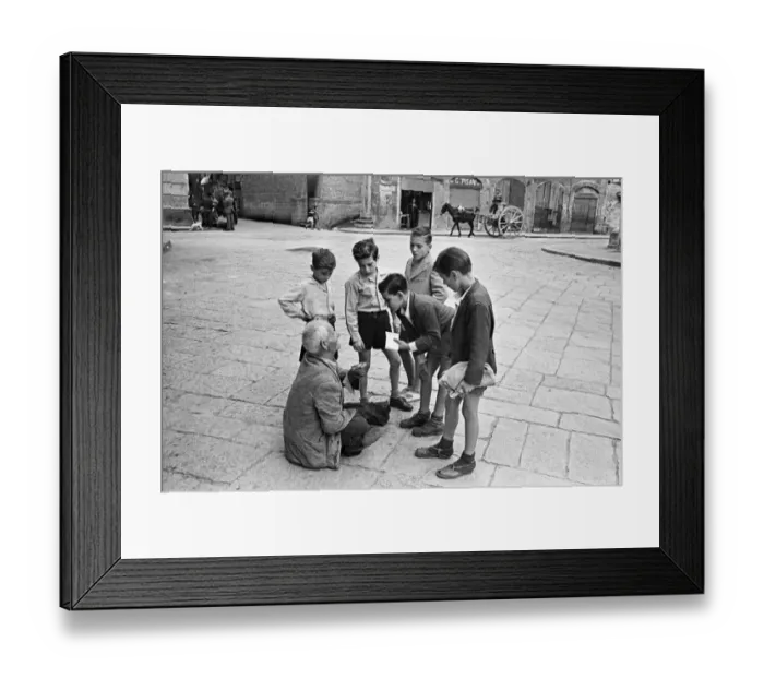 Framed Print : Scenes in Naples, southern Italy showing young boys talk to a beggar in the city streets Framed Print : Scenes in Naples, southern Italy showing young boys talk to a beggar in the city streets
