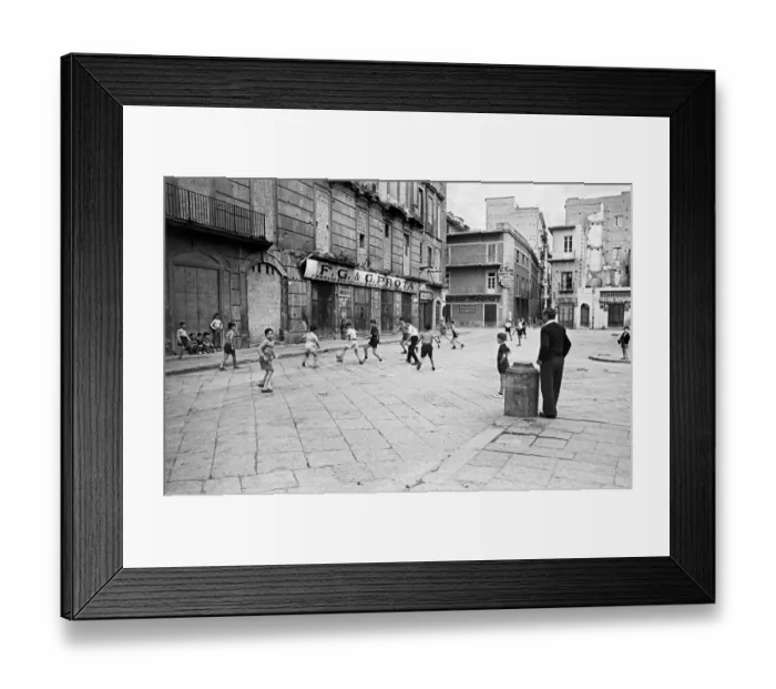 Framed Print : Scenes in Naples, southern Italy showing young boys enjoying a game of football in Framed Print : Scenes in Naples, southern Italy showing young boys enjoying a game of football in