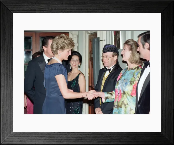 Framed Print : HRH Princess Diana, Princess of Wales is greeted by guests including singer Elton John Framed Print : HRH Princess Diana, Princess of Wales is greeted by guests including singer Elton John