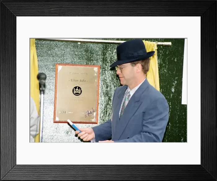 Framed Print : Singer Elton John unveils a plaque to mark the start of work on the AIDS clinic centre Framed Print : Singer Elton John unveils a plaque to mark the start of work on the AIDS clinic centre