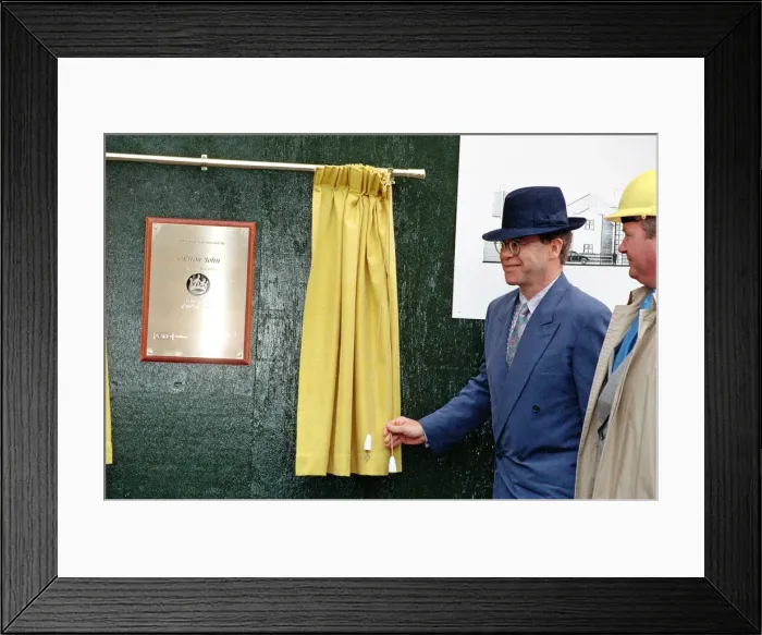 Framed Print : Singer Elton John unveils a plaque to mark the start of work on the AIDS clinic centre Framed Print : Singer Elton John unveils a plaque to mark the start of work on the AIDS clinic centre