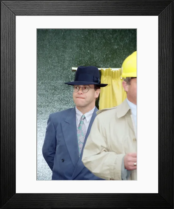 Framed Print : Singer Elton John unveils a plaque to mark the start of work on the AIDS clinic centre Framed Print : Singer Elton John unveils a plaque to mark the start of work on the AIDS clinic centre