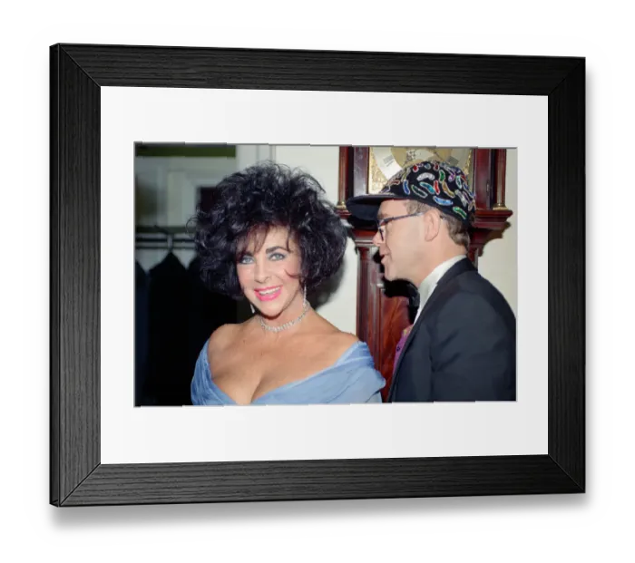 Framed Print : Elizabeth Taylor and Elton John at a gala dinner in aid of the AIDS Crisis Trust in