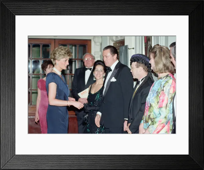 Framed Print : HRH Princess Diana, Princess of Wales is greeted by singer Elton John Framed Print : HRH Princess Diana, Princess of Wales is greeted by singer Elton John