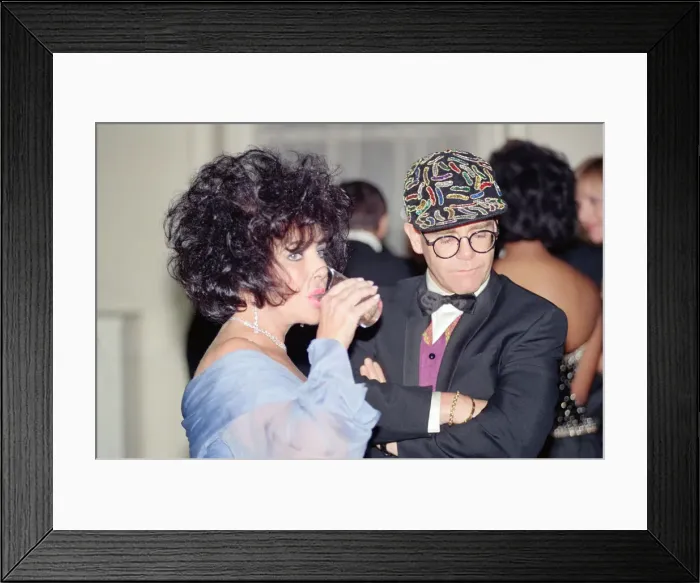 Framed Print : Elizabeth Taylor and Elton John at a gala dinner in aid of the AIDS Crisis Trust in Framed Print : Elizabeth Taylor and Elton John at a gala dinner in aid of the AIDS Crisis Trust in