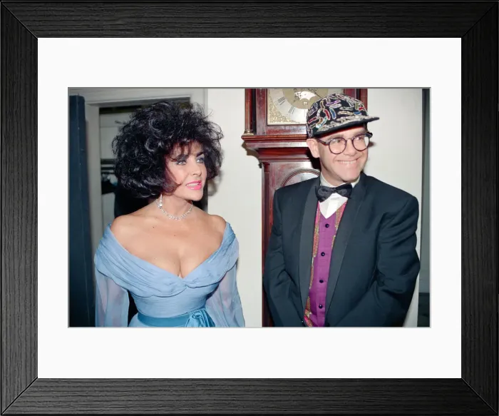 Framed Print : Elizabeth Taylor and Elton John at a gala dinner in aid of the AIDS Crisis Trust in Framed Print : Elizabeth Taylor and Elton John at a gala dinner in aid of the AIDS Crisis Trust in
