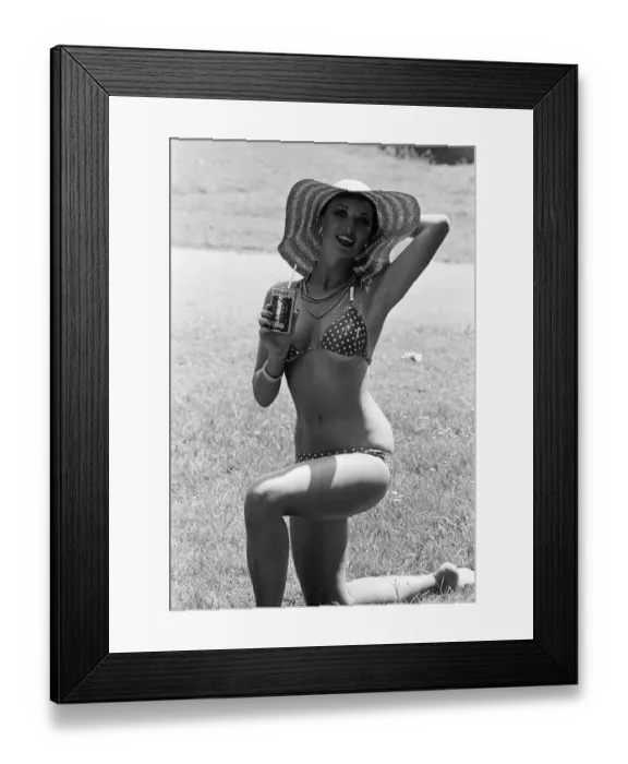 Framed Print : Young lady cools down with a refreshment as she enjoys the summer heatwave, Teesside