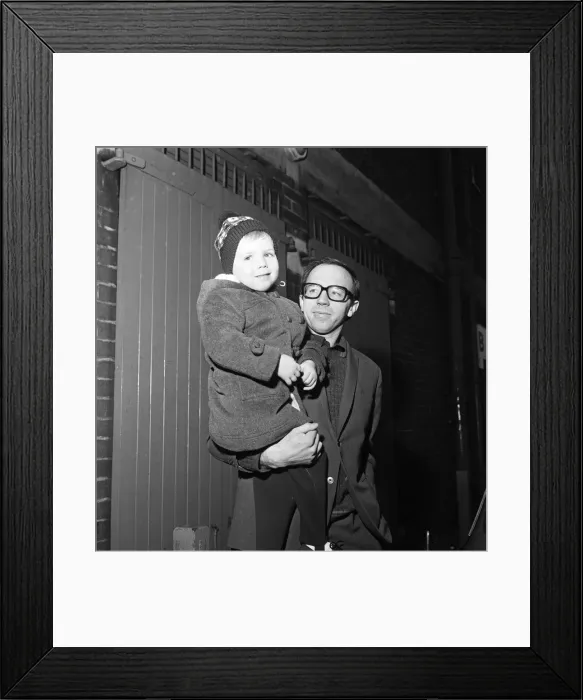 Framed Print : Nobby Stiles, the Manchester United half back leaves Old Trafford with his 3-year-old son