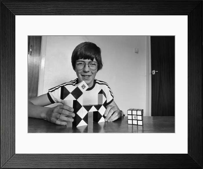 Framed Print : 14 year old Terence Wilson of Deepdale near Preston, with his Rubik cube and snake Framed Print : 14 year old Terence Wilson of Deepdale near Preston, with his Rubik cube and snake