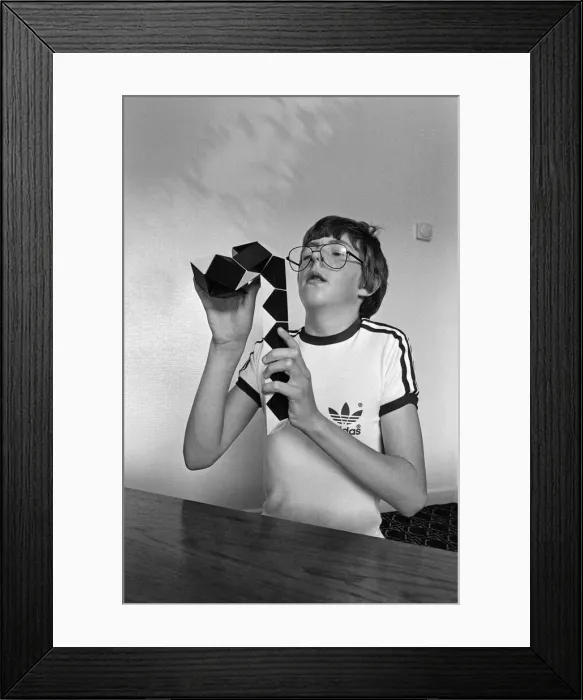 Framed Print : 14 year old Terence Wilson of Deepdale near Preston, with his Rubik snake Framed Print : 14 year old Terence Wilson of Deepdale near Preston, with his Rubik snake