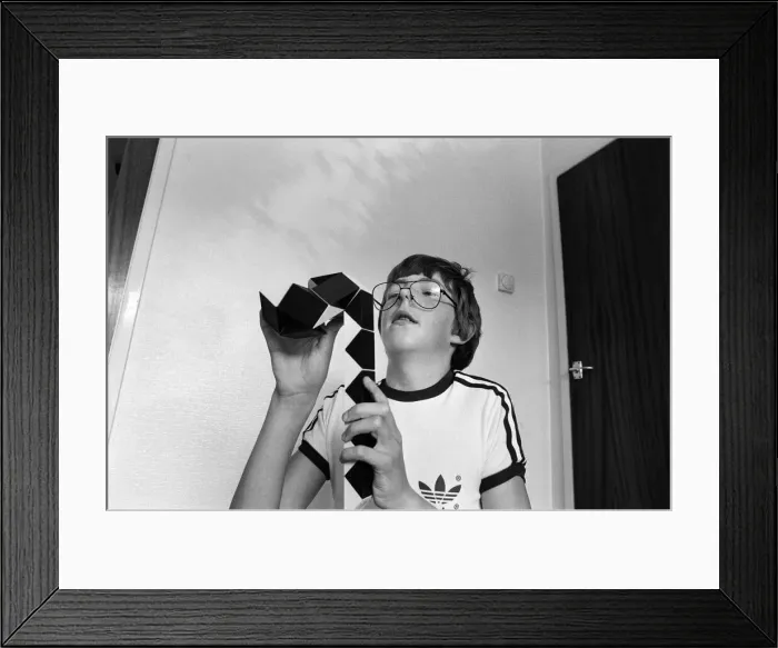 Framed Print : 14 year old Terence Wilson of Deepdale near Preston, with his Rubik snake Framed Print : 14 year old Terence Wilson of Deepdale near Preston, with his Rubik snake