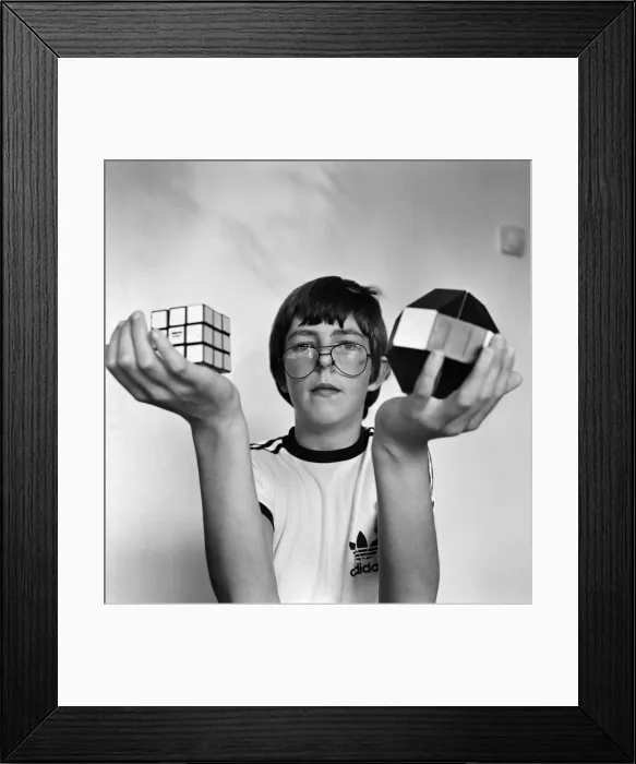 Framed Print : 14 year old Terence Wilson of Deepdale near Preston, with his Rubik cube and snake Framed Print : 14 year old Terence Wilson of Deepdale near Preston, with his Rubik cube and snake