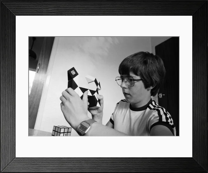Framed Print : 14 year old Terence Wilson of Deepdale near Preston, with his Rubik cube and snake Framed Print : 14 year old Terence Wilson of Deepdale near Preston, with his Rubik cube and snake