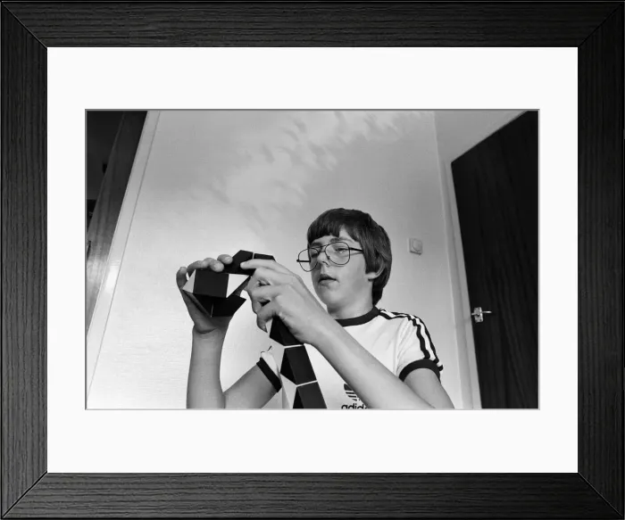 Framed Print : 14 year old Terence Wilson of Deepdale near Preston, with his Rubik snake Framed Print : 14 year old Terence Wilson of Deepdale near Preston, with his Rubik snake
