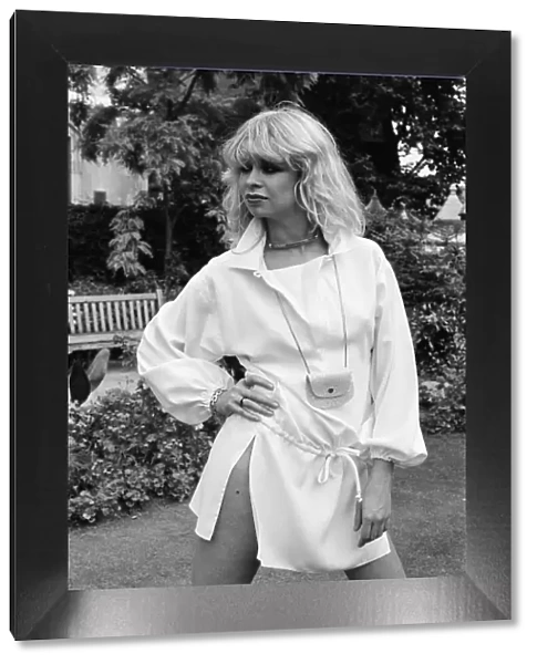 Model wearing 1977 clothing, Sunday Mirror fashion feature, pictured in garden