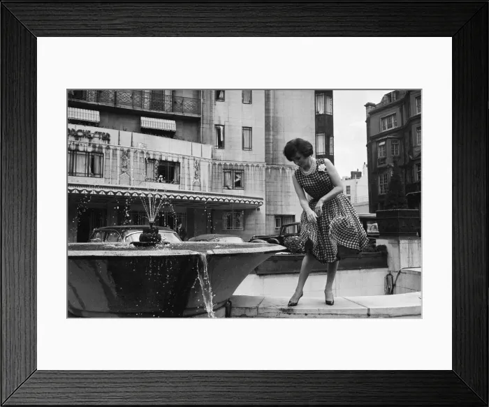 Framed Print : Gina Lollobrigida, Italian actress, poses for pictures outside the Dorchester Hotel