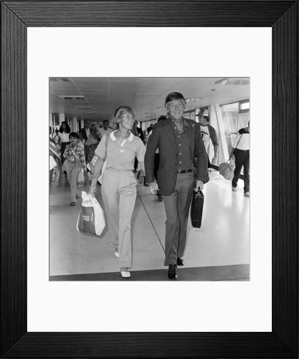 Framed Print : Michael Parkinson arrives at Heathrow with his wife Mary Framed Print : Michael Parkinson arrives at Heathrow with his wife Mary