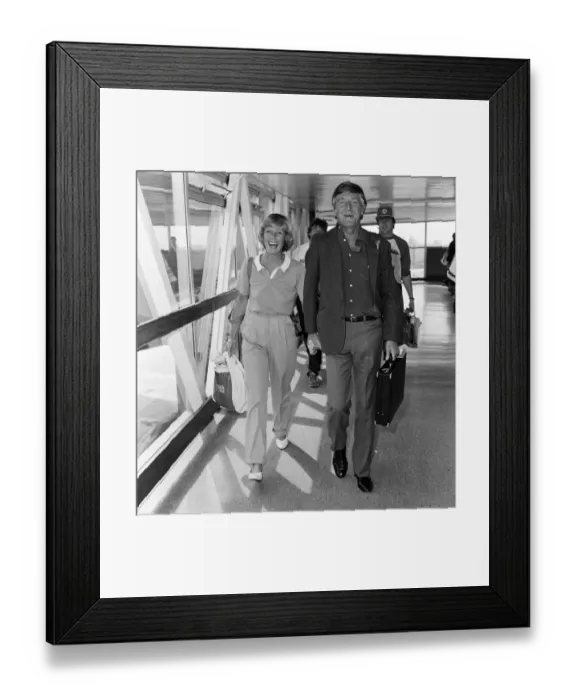 Framed Print : Michael Parkinson arrives at Heathrow with his wife Mary Framed Print : Michael Parkinson arrives at Heathrow with his wife Mary