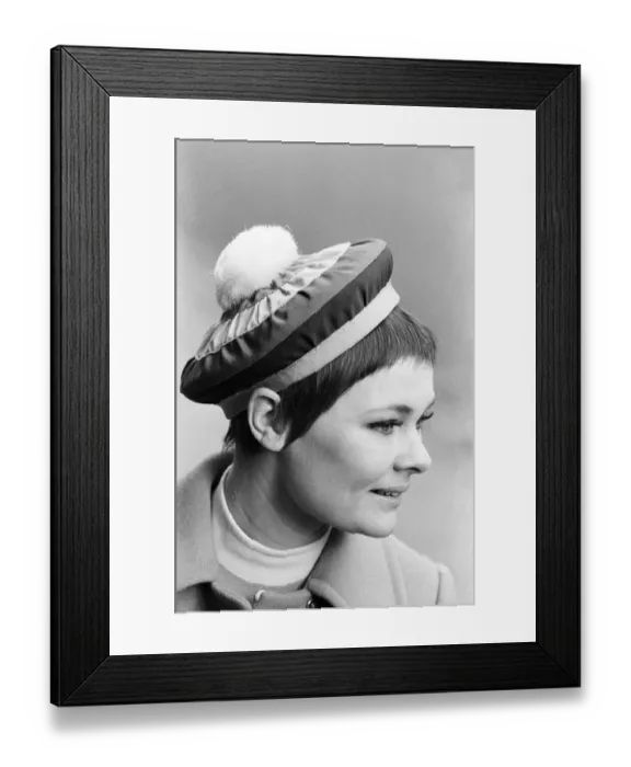 Framed Print : Judi Dench being photographed by the press wearing a Christian Dior beret called Framed Print : Judi Dench being photographed by the press wearing a Christian Dior beret called