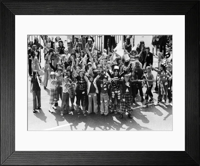 Framed Print : Fans of pop group Slade get ready for the invasion of Earls Court tonight where the group