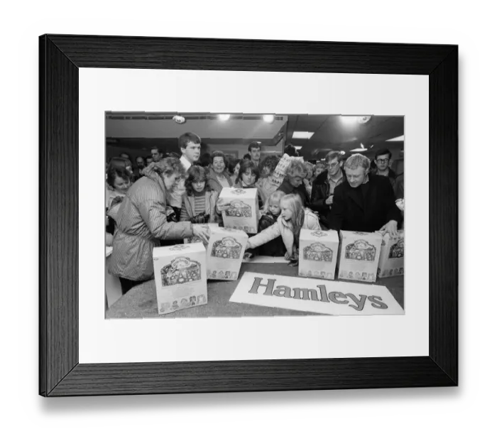 Framed Print : Shoppers buying Cabbage Patch Dolls at Hamleys, London toy store. 3rd December 1983