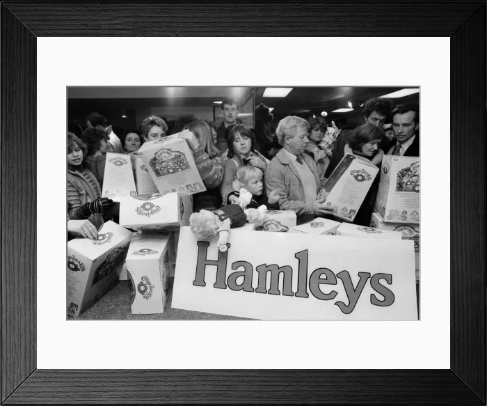 Framed Print : Shoppers buying Cabbage Patch Dolls at Hamleys, London toy store. 3rd December 1983