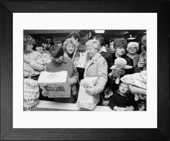 Framed Print : Shoppers buying Cabbage Patch Dolls at Hamleys, London toy store. 3rd December 1983