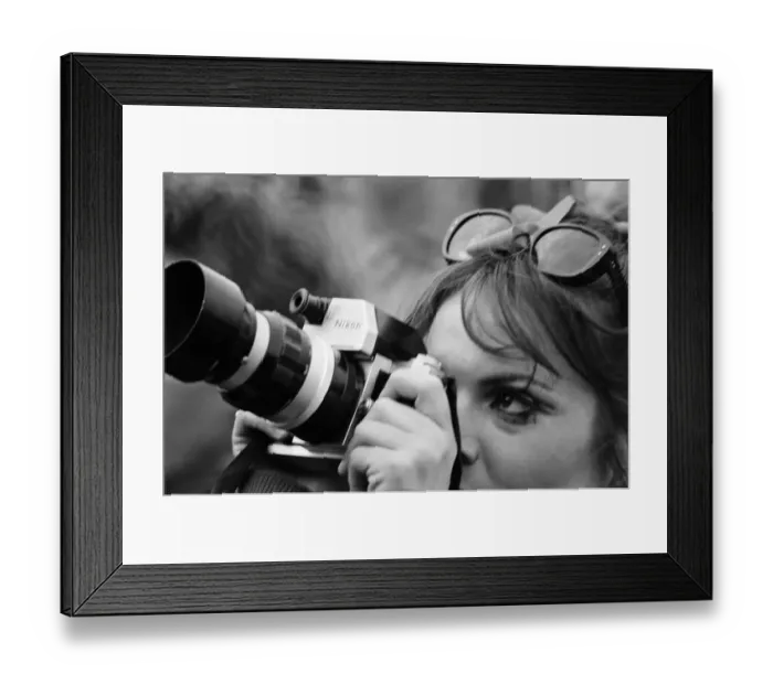 Framed Print : A lady festival goer takes a picture with her Nikon Camera at The Windsor Jazz Festival Framed Print : A lady festival goer takes a picture with her Nikon Camera at The Windsor Jazz Festival