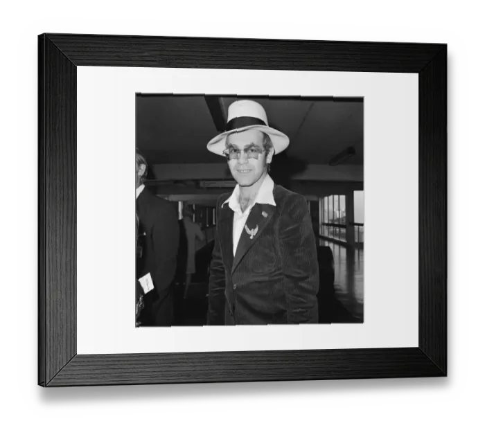 Framed Print : Elton John leaves Heathrow Airport. He is going to Los Angeles for the party of Elton