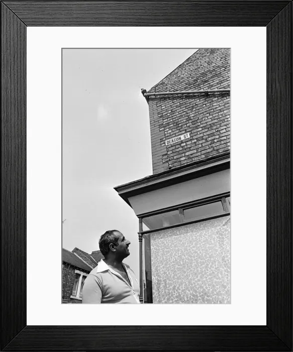 Framed Print : A swarm of bees at the top of some guttering outside Yasmin s'shop Framed Print : A swarm of bees at the top of some guttering outside Yasmin s'shop