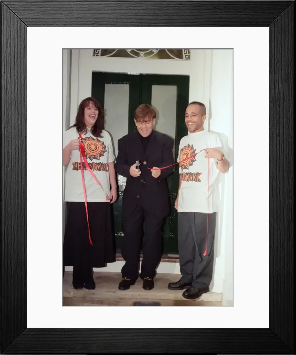 Framed Print : Elton John opening an AIDS Cenre in Brixton. 29th November 1994
