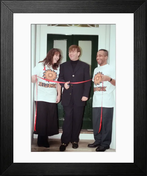 Framed Print : Elton John opening an AIDS Cenre in Brixton. 29th November 1994