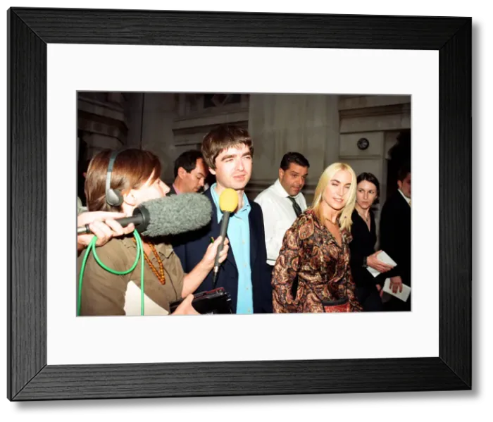 Framed Print : Noel Gallagher and his girlfriend Meg Matthews at 10 Downing Street for a party held by