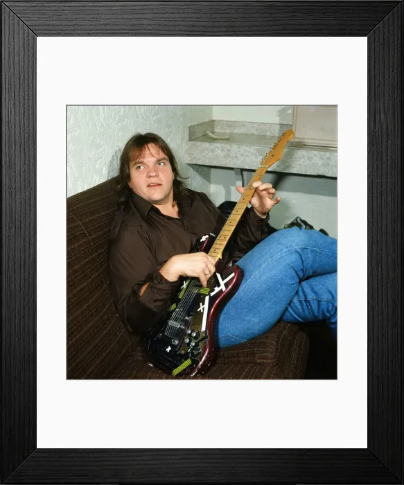 Framed Print : Musician Meat Loaf playing his guitar. September 1983
