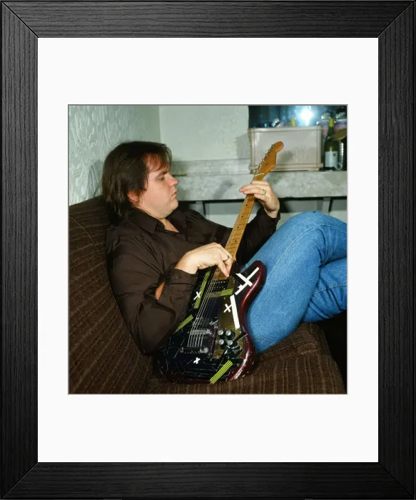 Framed Print : Musician Meat Loaf playing his guitar. September 1983 Framed Print : Musician Meat Loaf playing his guitar. September 1983