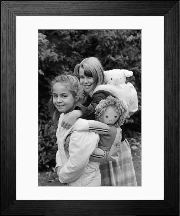 Framed Print : Two young girls wearing soft toy rucksacks. 21st October 1986 Framed Print : Two young girls wearing soft toy rucksacks. 21st October 1986