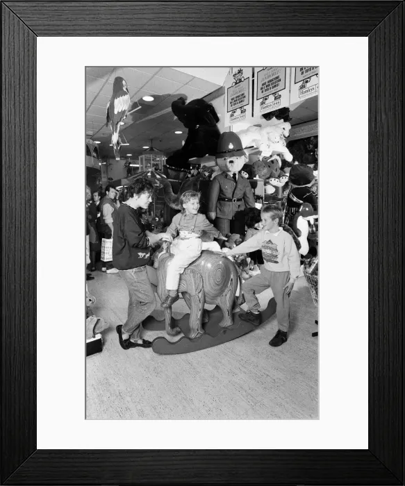 Framed Print : Young children playing with toys in Hamley s, London. 21st October 1986 Framed Print : Young children playing with toys in Hamley s, London. 21st October 1986